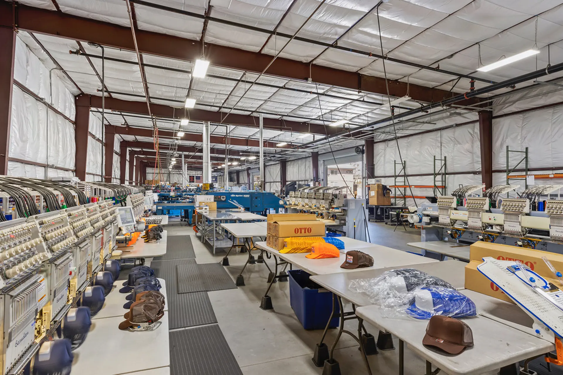 Embroidery department with multiple machines and workstations