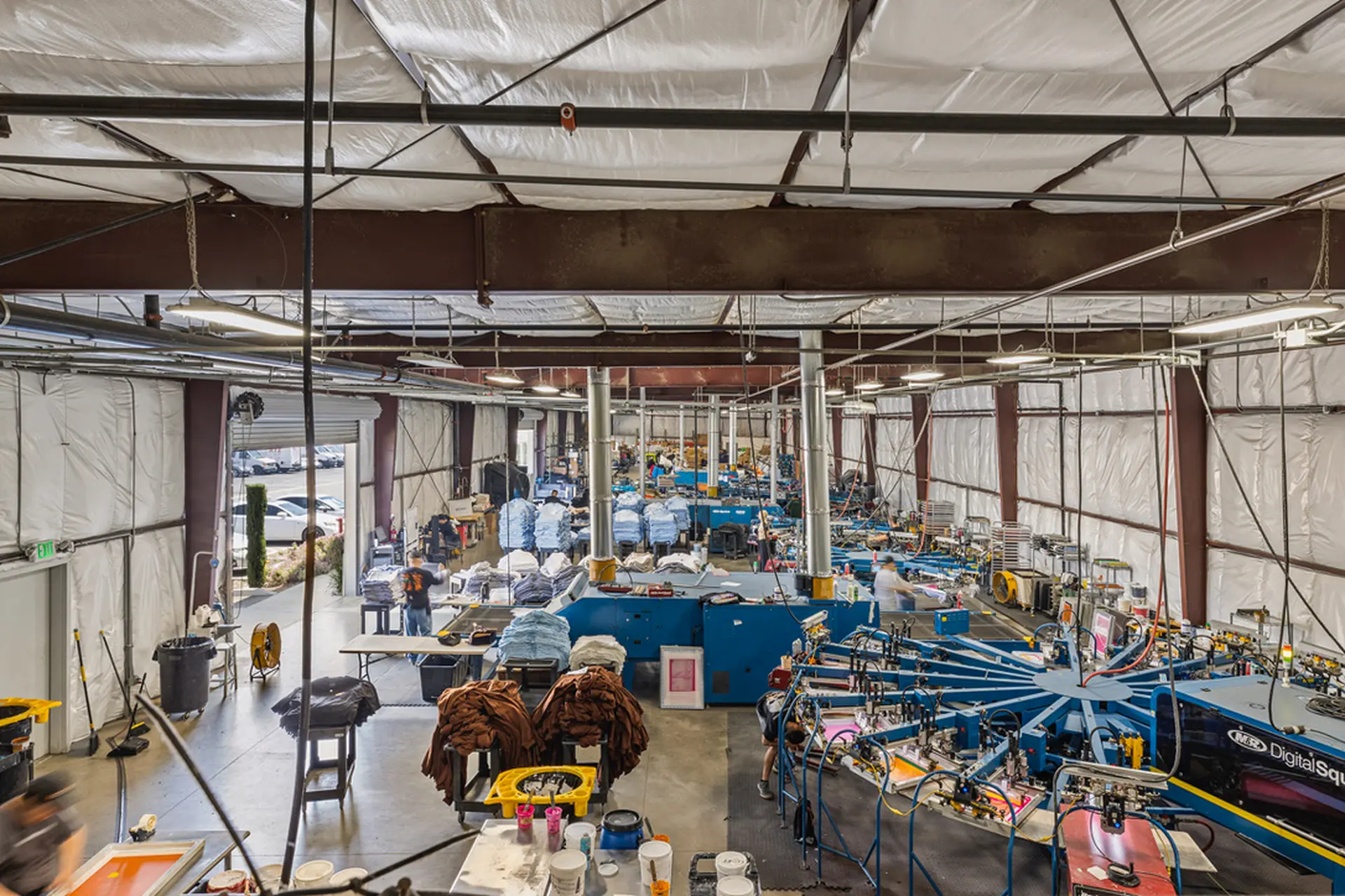 Screen printing production floor with multiple press stations