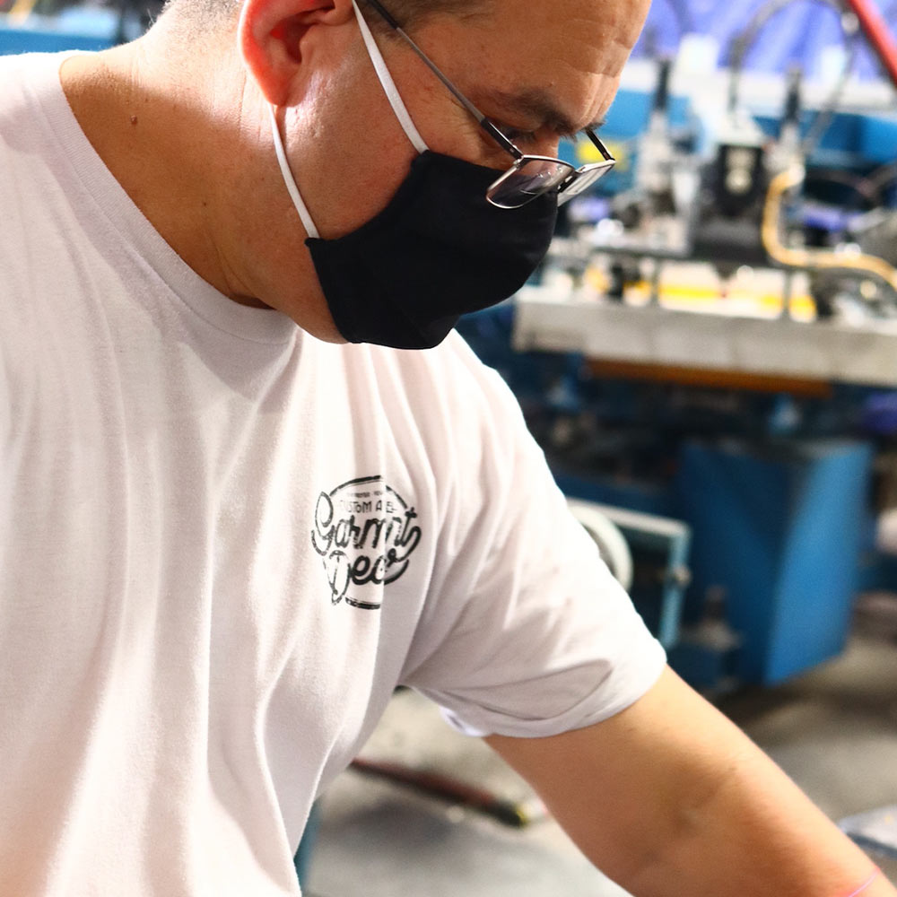 Garment Decor's skilled screen printer ensures top-notch quality for Titans Cal State Fullerton's custom designs. Each Gildan Hammer™ T-Shirt is printed with precision and care, embodying craftsmanship and team pride.
