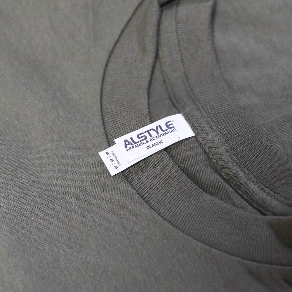 Close-up of a gray alstyle apparel & activewear clothing label on a garment.