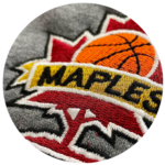Close-up of a sports team logo embroidery services, featuring a basketball and bold lettering.