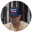 A man wearing a cap, suitable for brands, looking directly at the camera with a neutral expression.