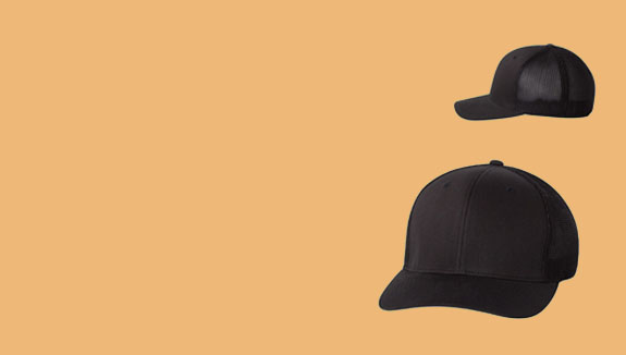 Two black baseball caps on a beige background to get started.