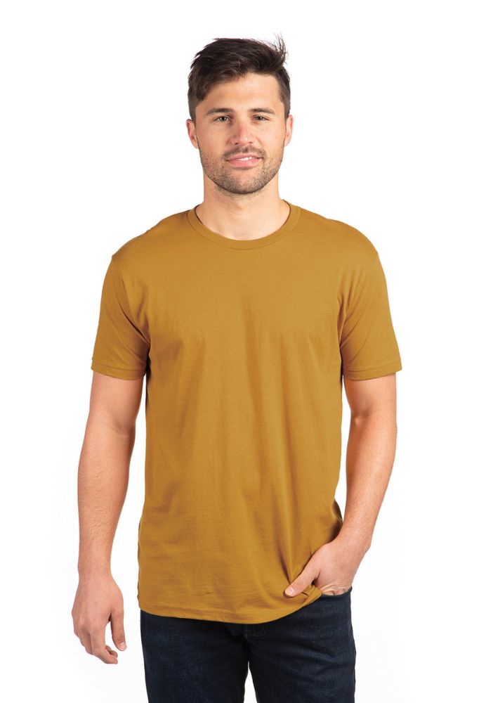 Man in a mustard-colored t-shirt posing against a white background.