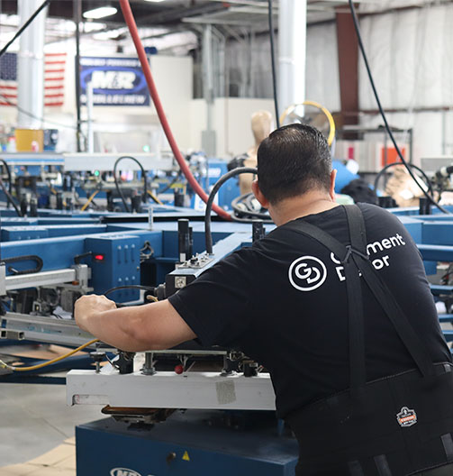 A worker operating machinery in an industrial setting.