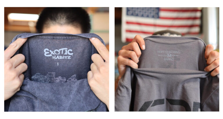 A split image showing two individuals holding up the inside of t-shirts, displaying labels from different brands, with a blurry american flag in the background on the right side.