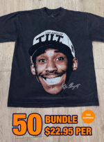 A black T-shirt featuring a large graphic of a smiling individual, with text "Los Angeles" and "Tilt". Text overlay reads "36 Custom Streetwear T-Shirts – Heavyweight Garment-Dyed Cotton $22.95 PER" with a small "FREE SHIPPING" badge.