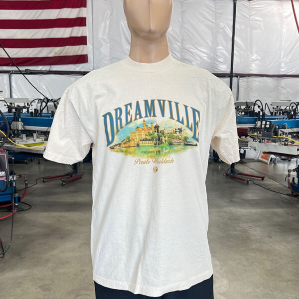 This is a photo of a white t-shirt with a water-based screen print design on the front and it's on a mannequin.