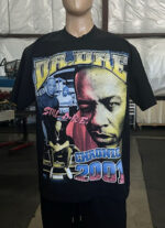 A mannequin displays a 50 Custom Streetwear T-Shirts - Heavyweight Garment-Dyed Shirt With Screen Printing featuring images, the text "Dr. Dre," "Still D.R.E.," and "Chronic 2001," with a graphic design in various colors.