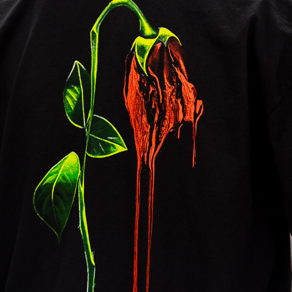 Zoomed in back view photo a black Los Angeles Apparel 1801GD 6.5oz Garment Dye Crew Neck T-Shirt with a jumbo 4 color screen print for the back view printed by Garment Decor - Garment Decor Zoomed in back view photo a black Los Angeles Apparel 1801GD 6.5oz Garment Dye Crew Neck T-Shirt with a jumbo 4 color screen print for the back view printed by Garment Decor