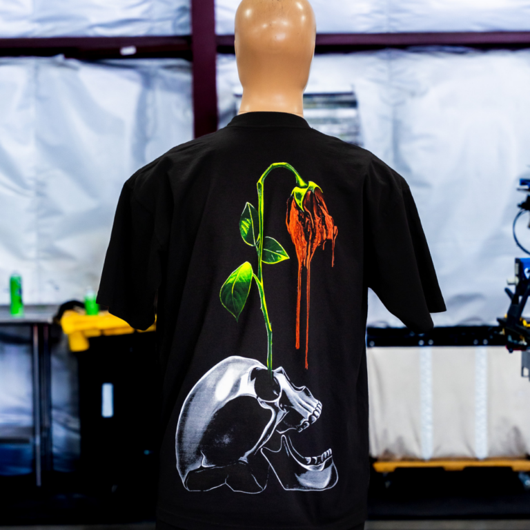 Jumbo screen printed Los Angeles Apparel 1801GD 6.5oz Garment Dye Crew Neck T-Shirt Black back view - Garment Decor A mannequin wearing a black Los Angeles Apparel 1801GD 6.5oz Garment Dye Crew Neck T-Shirt with a jumbo 4 color screen print for the back view printed by Garment Decor